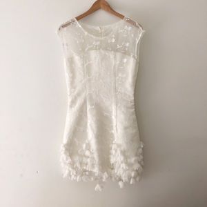 Beautiful white mini dress with hand sewn flowers